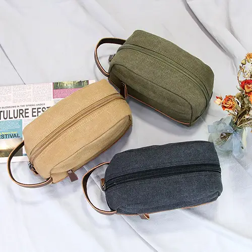 Water-resistant 16oz waxed canvas material developing unique patina over time for heritage toiletry bags